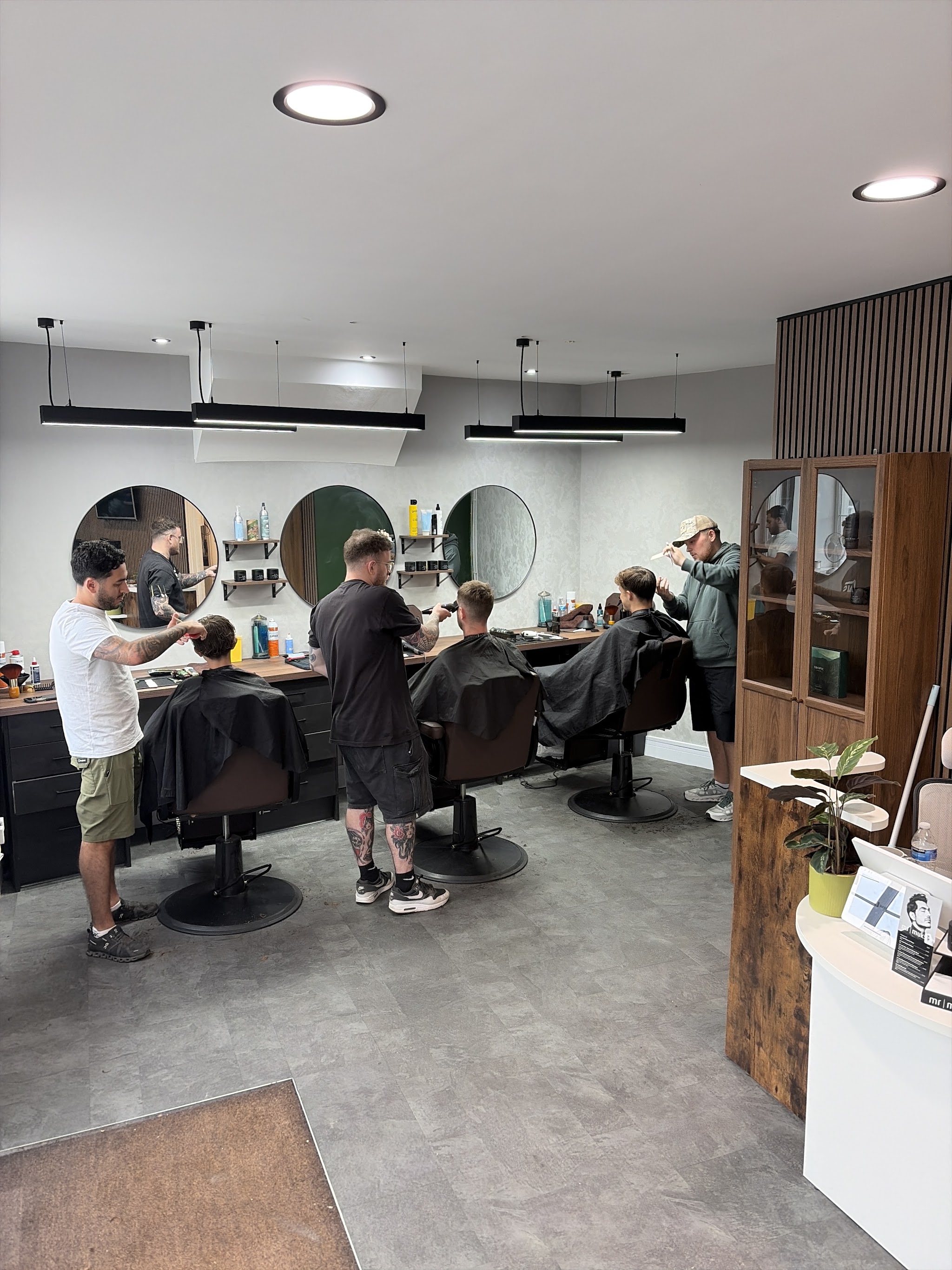 Barbers at work in B&C's three-chair Horsforth shop