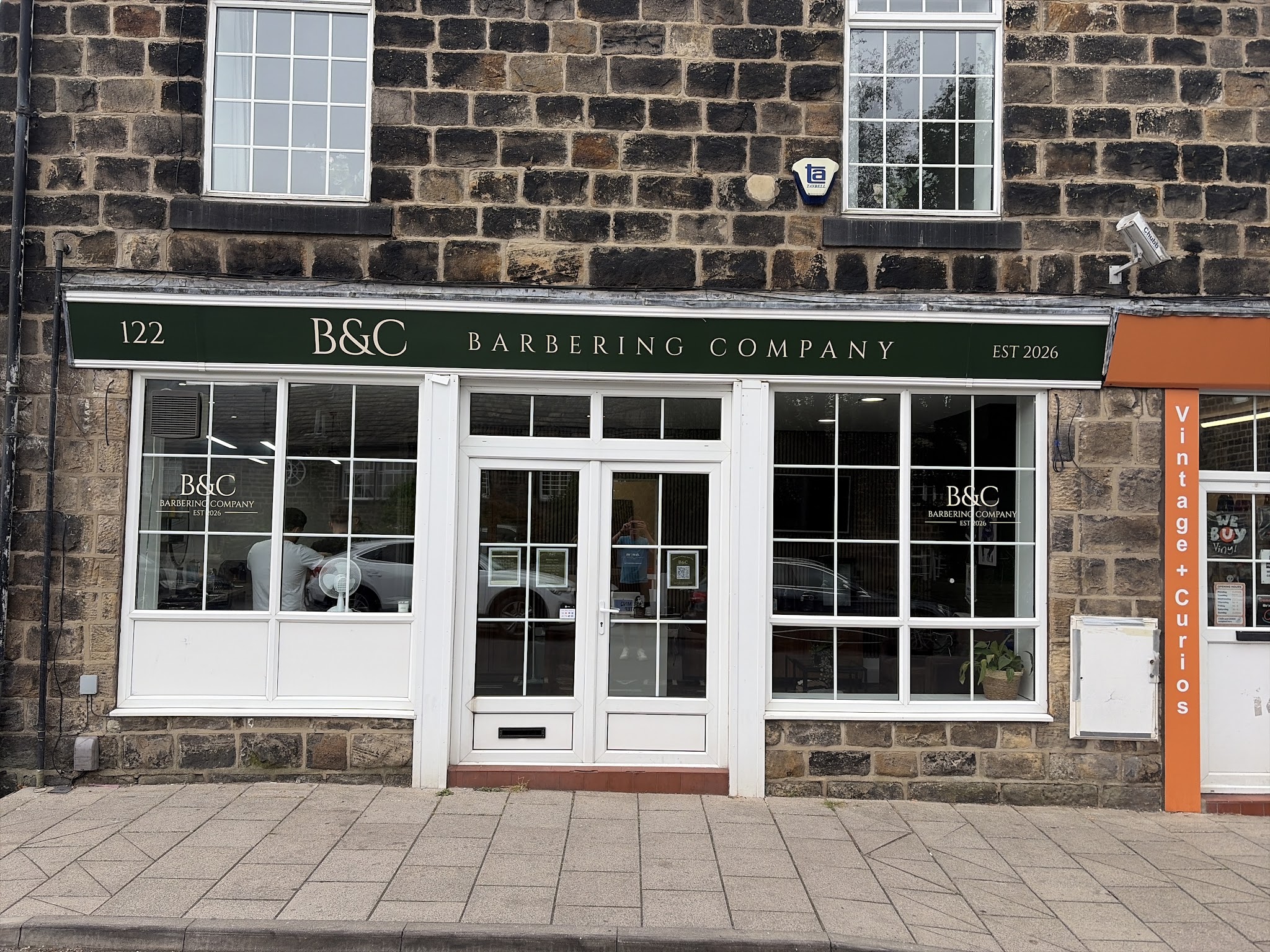 B&C Barbering Company's green and cream shopfront at 122 Town Street, Horsforth